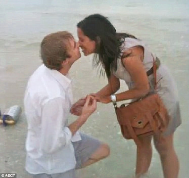 The beach proposal ring is missing because she agreed! .jpg