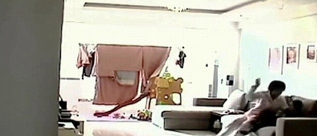 The Chinese nanny was secretly photographed and kicked and beaten the 5 year old boy .jpg