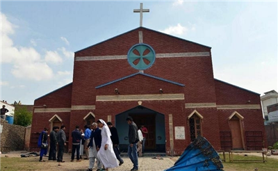 A series of explosions in a Pakistani church killed 14 and 78 injured (below).jpg
