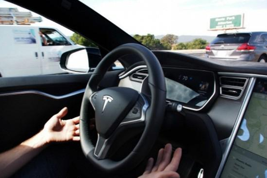 Tesla released a software upgrade to include autonomous driving functions.jpg