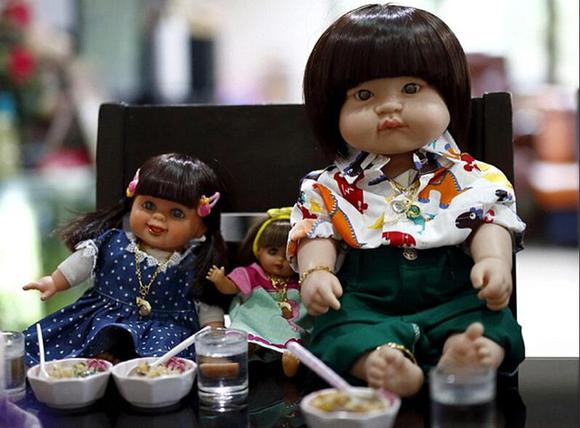 泰国兴起供奉“娃娃神” 上飞机有专座1.jpg