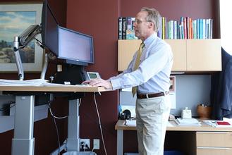 Research shows that using a standing desk will make employees more efficient.jpg