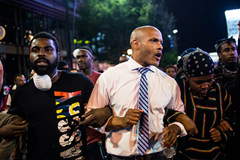 The protesters ignored the curfew imposed by the city of Charlotte due to police shooting .jpg
