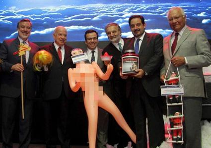 Chilean Minister of Economy gets a gift of inflatable dolls to anger domestic people.jpg