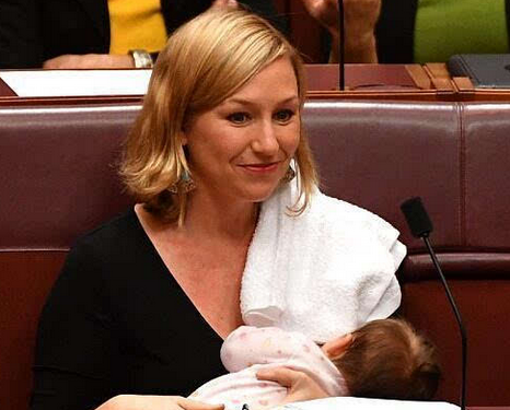 A pioneer in Australia, a female parliamentarian breastfeeding during a meeting.jpg