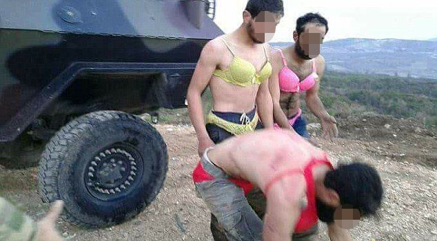 Syrian refugees are humiliated across the border and forced to wear female underwear.jpg