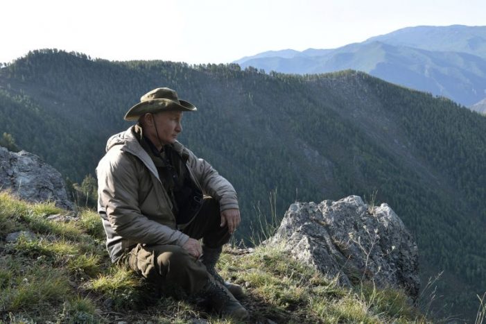 The 65-year-old Putin’s vacation photos reveal a hike in the mountains and a distant view.jpg