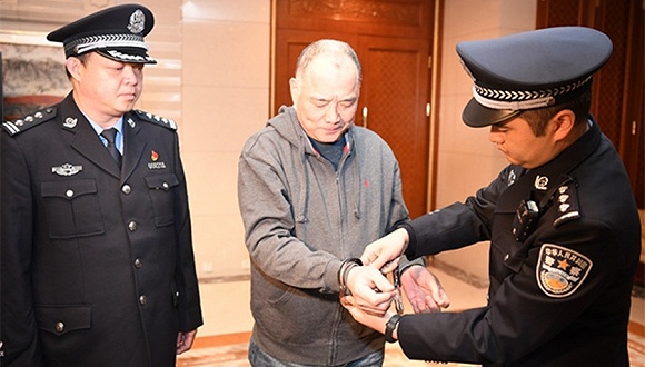 Red wanted fugitive Zheng Quanguan was forcibly deported from the United States.jpg