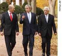 President Bush walks with Ehud Olmert, left, and Mahmoud Abbas to the conference at the U.S. Naval Academy in Annapolis