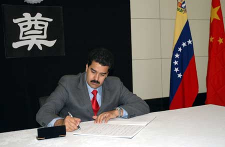 Venezuelan Foreign Minister Nicolas Maduro signs on the book of condolence during a mourning ceremony held at the Chinese Embassy in Caracas, capital of Venezuela, on May 19, 2008. Staffers of the Embassy, local Chinese and overseas Chinese and some U.S officers attended the mourning ceremony on Tuesday for the victims of the 8.0-magnitude quake on Richter scale hitting southwest and northwest China&apos;s regions on May 12. 