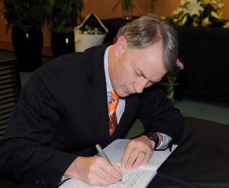 New Zealand Trade Minister Phil Goff signs on the book of condolence during a mourning ceremony held at the Chinese Embassy in Wellington, capital of New Zealand, on May 20, 2008. Staffers of the Embassy, local Chinese and overseas Chinese and some New Zealand officers attended the mourning ceremony on Tuesday for the victims of the 8.0-magnitude quake on Richter scale hitting southwest and northwest China&apos;s regions on May 12.