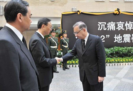 Japanese Ambassador Yuji Miyamoto (R) shakes hands with Chinese Foreign Minister Yang Jiechi after attending a mourning ceremony for victims of the May 12 earthquake hitting southwest and northwest China, at China&apos;s Foreign Ministry in Beijing, capital of China, May 19, 2008.